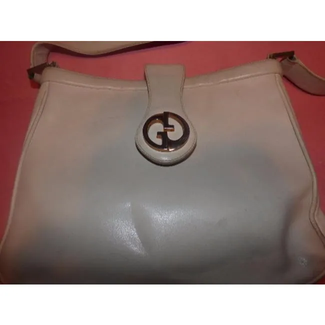 Vintage, mod, Gucci, white leather 1973 shoulder bag with a gold GG flap snap lock