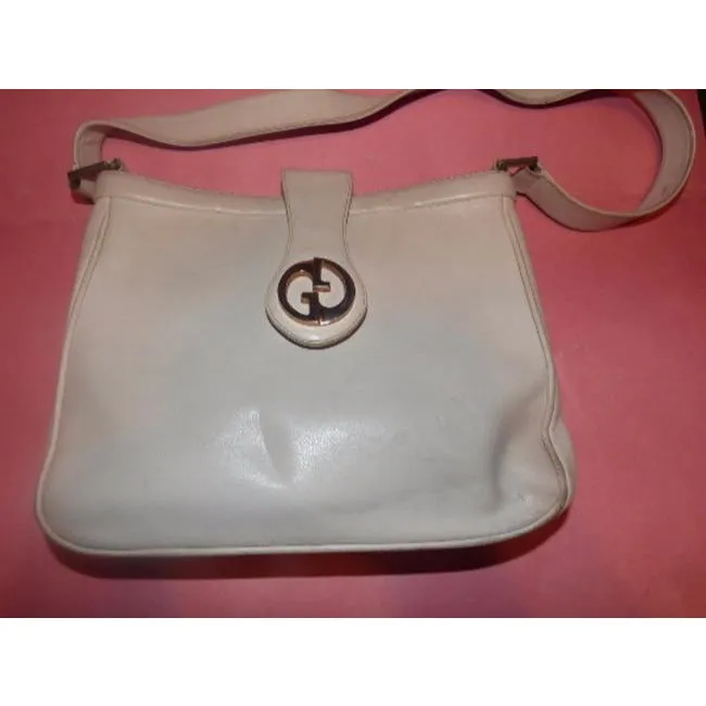 Vintage, mod, Gucci, white leather 1973 shoulder bag with a gold GG flap snap lock